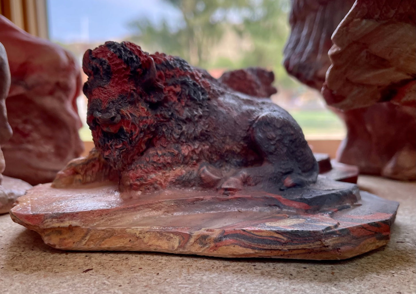 Small laying Buffalo by Kicking Bird Pottery